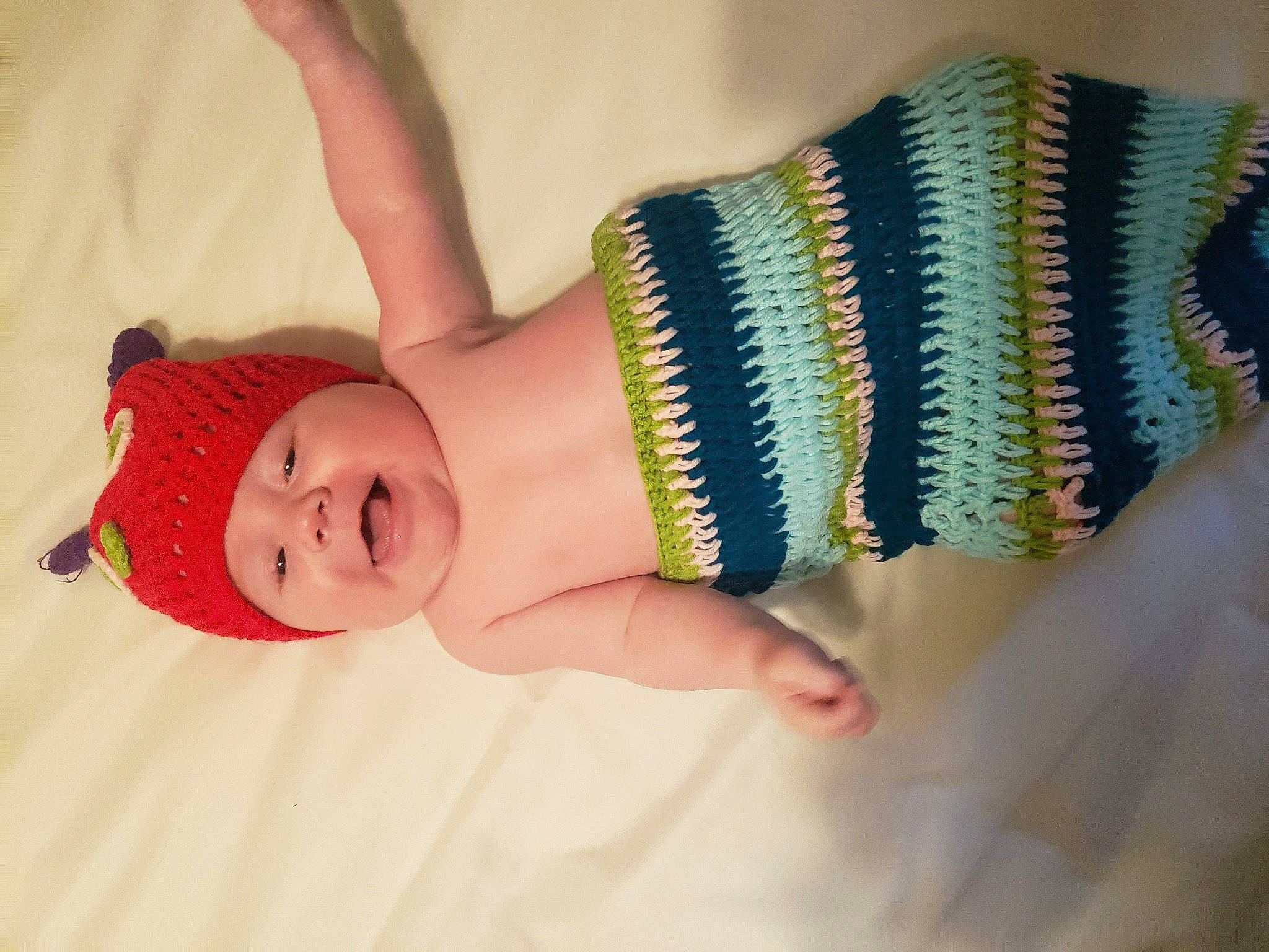 Axton joined the competition — help win amazing prizes! arm, art, baby, baby_toddler_clothing, child, finger, hand, happy, headband, headgear, headwear, human_body, human_leg, jewellery, pattern, person, pink, smile, textile, thigh