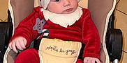 Lyzio participe au concours pour gagner de l'argent avec cette photo : baby, bonnet, cap, car, clothing, costume, face, furniture, hat, head, hood, hosiery, newborn, person, photography, portrait, sock, stroller, transportation, vehicle