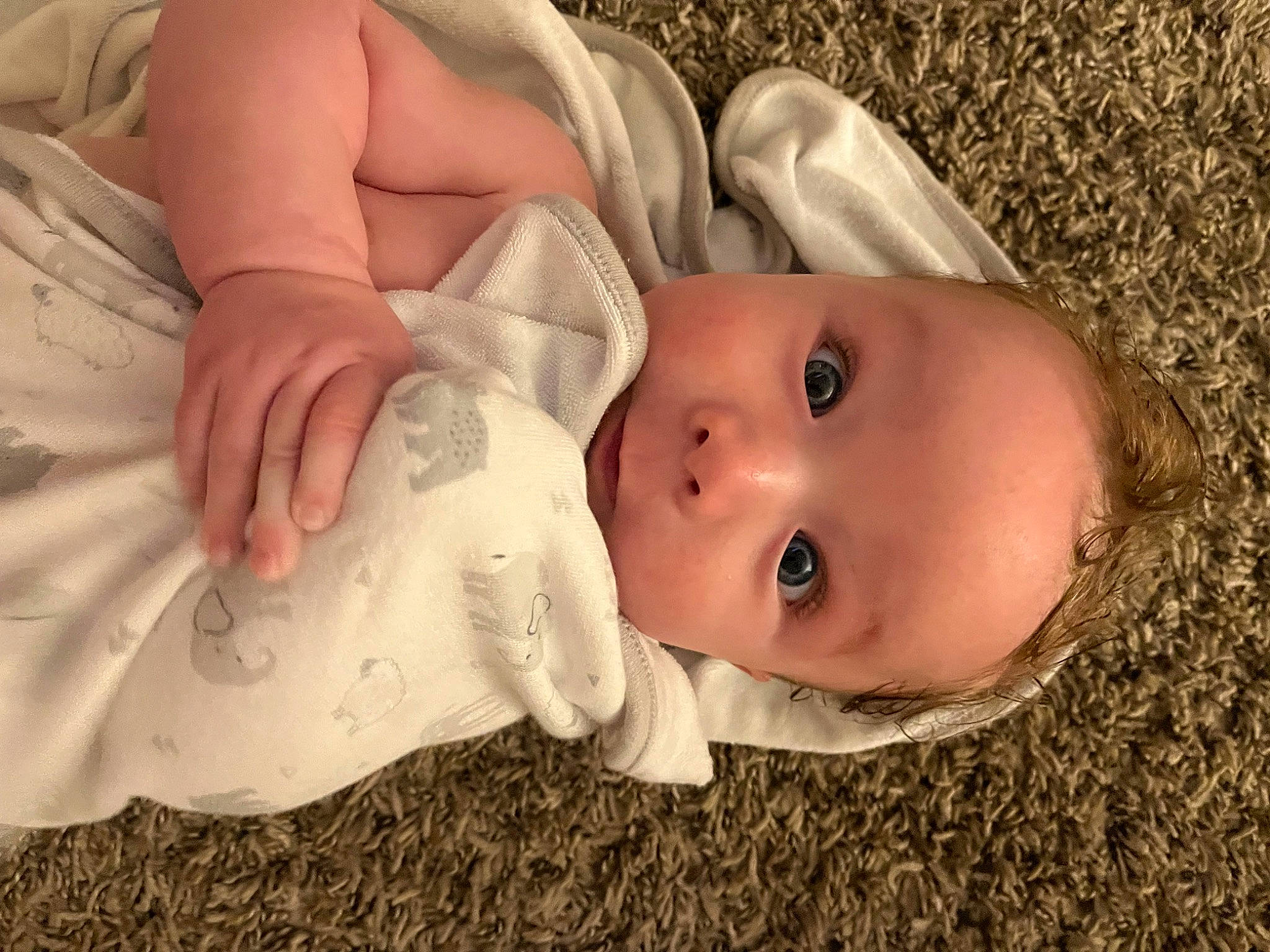 Chevy is registered to the contest to win money with this photo: baby, baby_products, baby_toddler_clothing, cheek, child, comfort, eyelash, facial_expression, fashion_accessory, grass, happy, hat, linens, lip, nose, person, portrait_photography, skin, smile, toddler