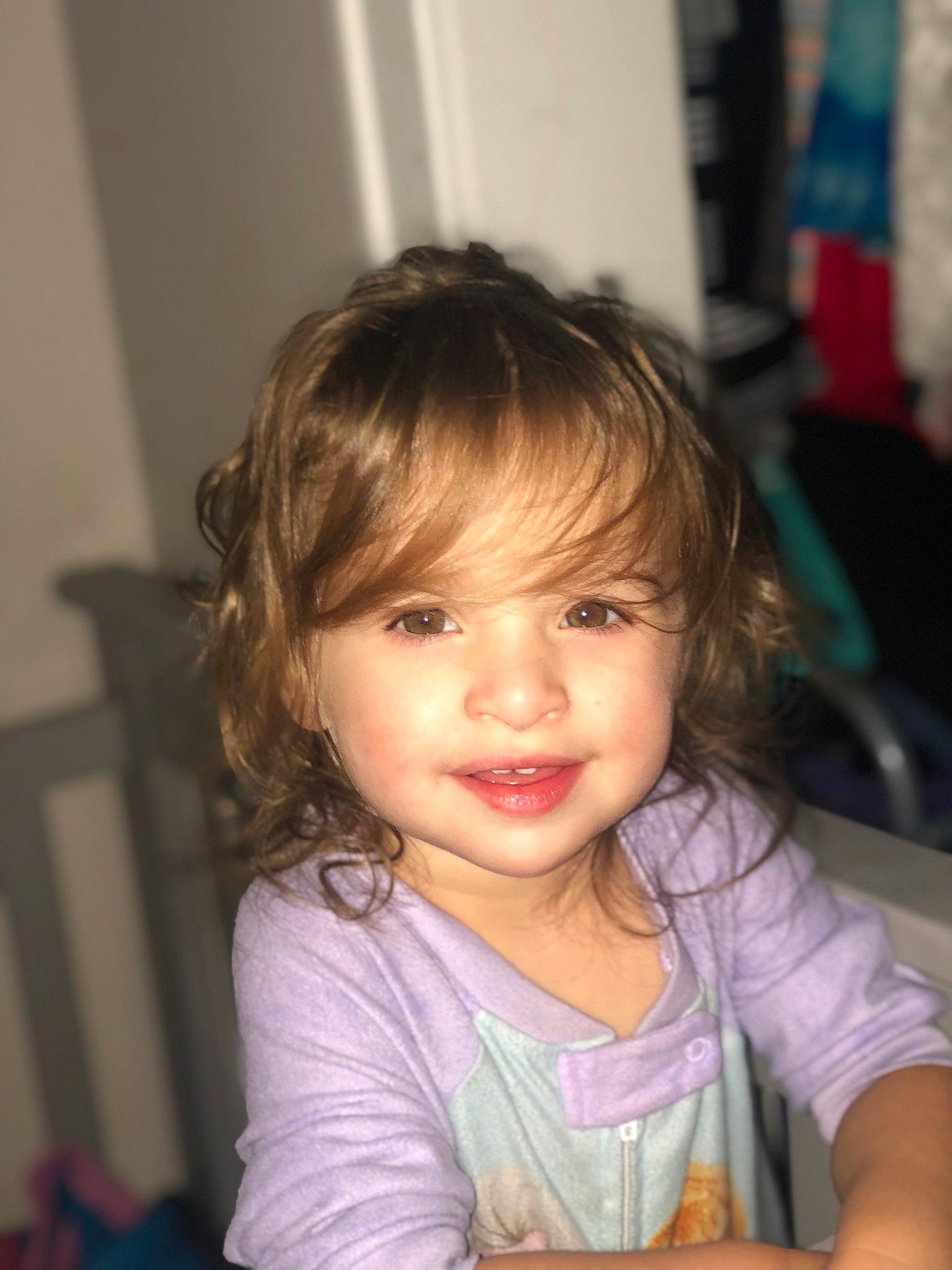 Amiya is registered to the contest to win money with this photo: baby_toddler_clothing, bangs, cheek, child, chin, eye, eyebrow, eyelash, finger, fun, happy, iris, joy, lip, long_hair, nose, person, sitting, skin, smile