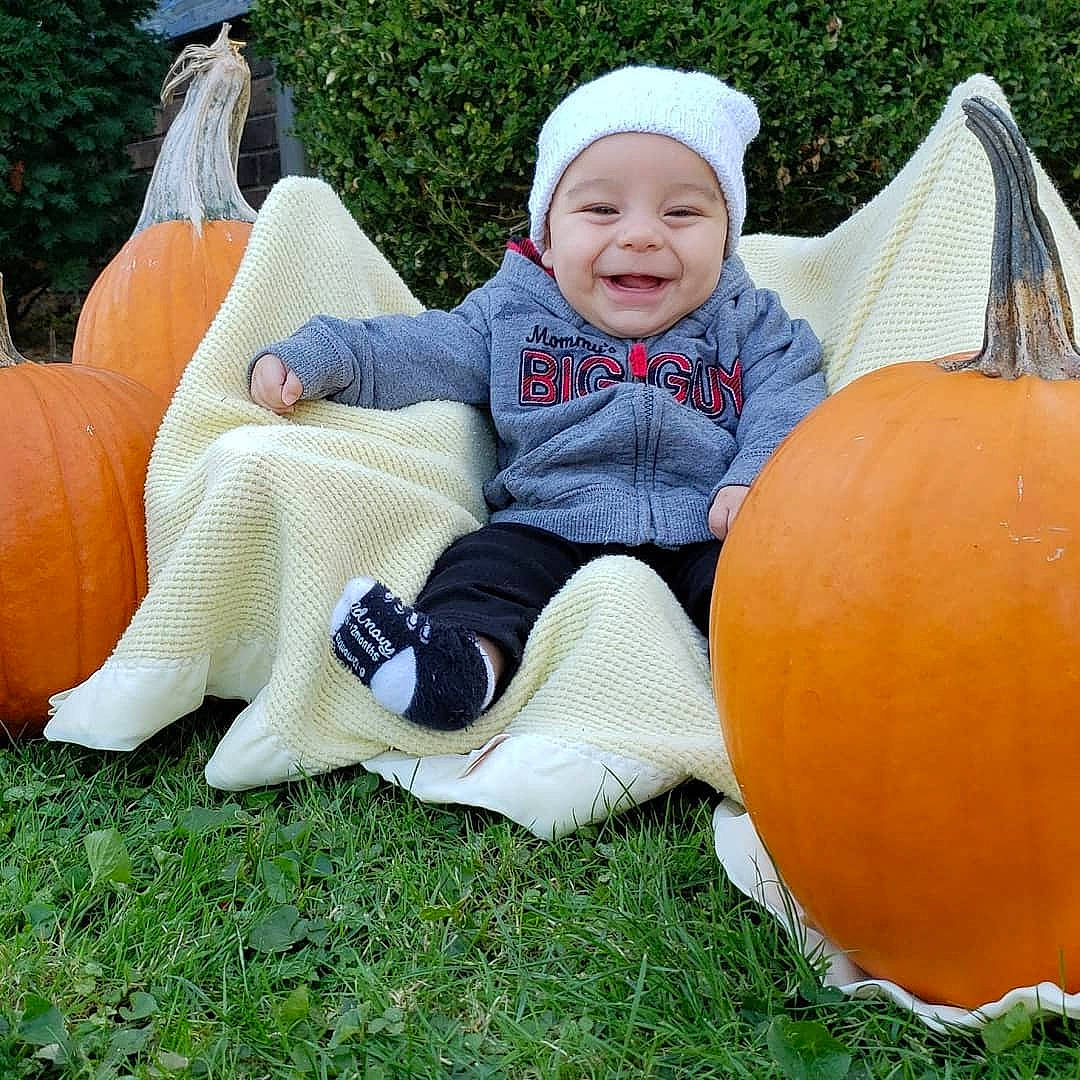 Karlyle is registered to the contest to win money with this photo: _and_melon_family, _gourd, baby, calabaza, child, cucumber, cucurbita, gourd, grass, headwear, joy, person, plant, play, pumpkin, sitting, squash, toddler, vegetable, winter_squash