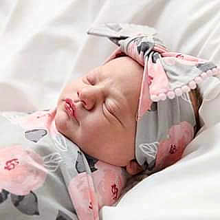Aisley joined the competition — help win amazing prizes! baby, baby_sleeping, bedtime, birth, cheek, child, childbirth, ear, hair_accessory, nap, nose, photography, pink, skin, sleep, textile, toddler