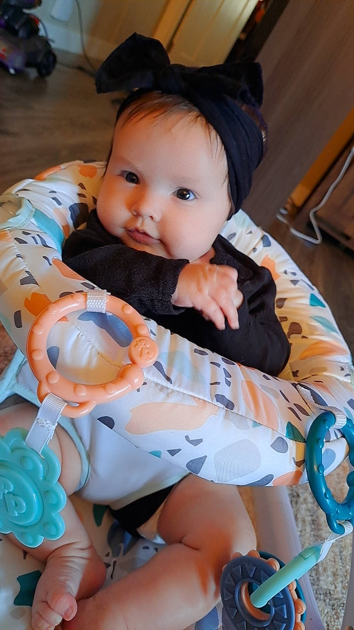 Rebecca joined the competition — help win amazing prizes! baby, baby_carriage, baby_products, baby_toddler_clothing, cheek, child, eye, face, fashion_accessory, fun, happy, head, human_leg, pattern, person, personal_protective_equipment, sitting, skin, sleeve, toddler