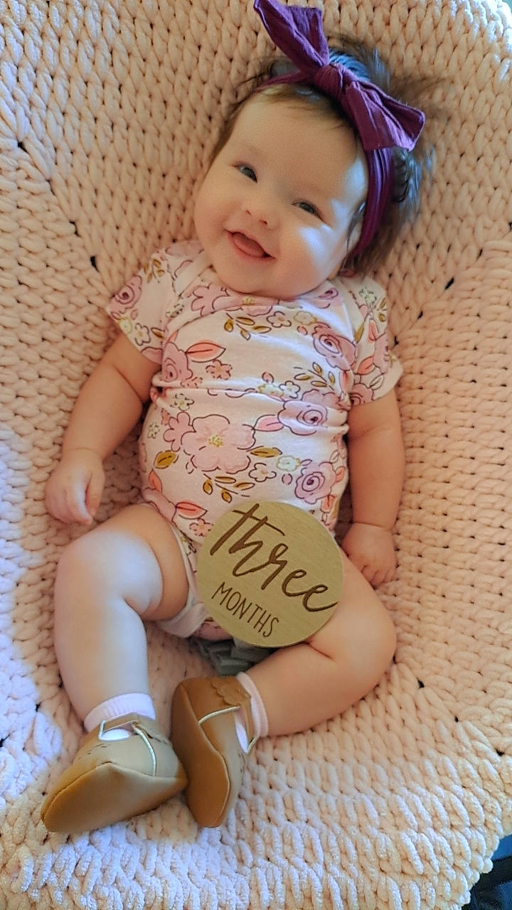 Rebecca joined the competition — help win amazing prizes! baby, baby_toddler_clothing, cheek, child, finger, happy, headgear, human_body, human_leg, joy, knee, leg, neck, pattern, person, pink, skin, sleeve, smile, sock