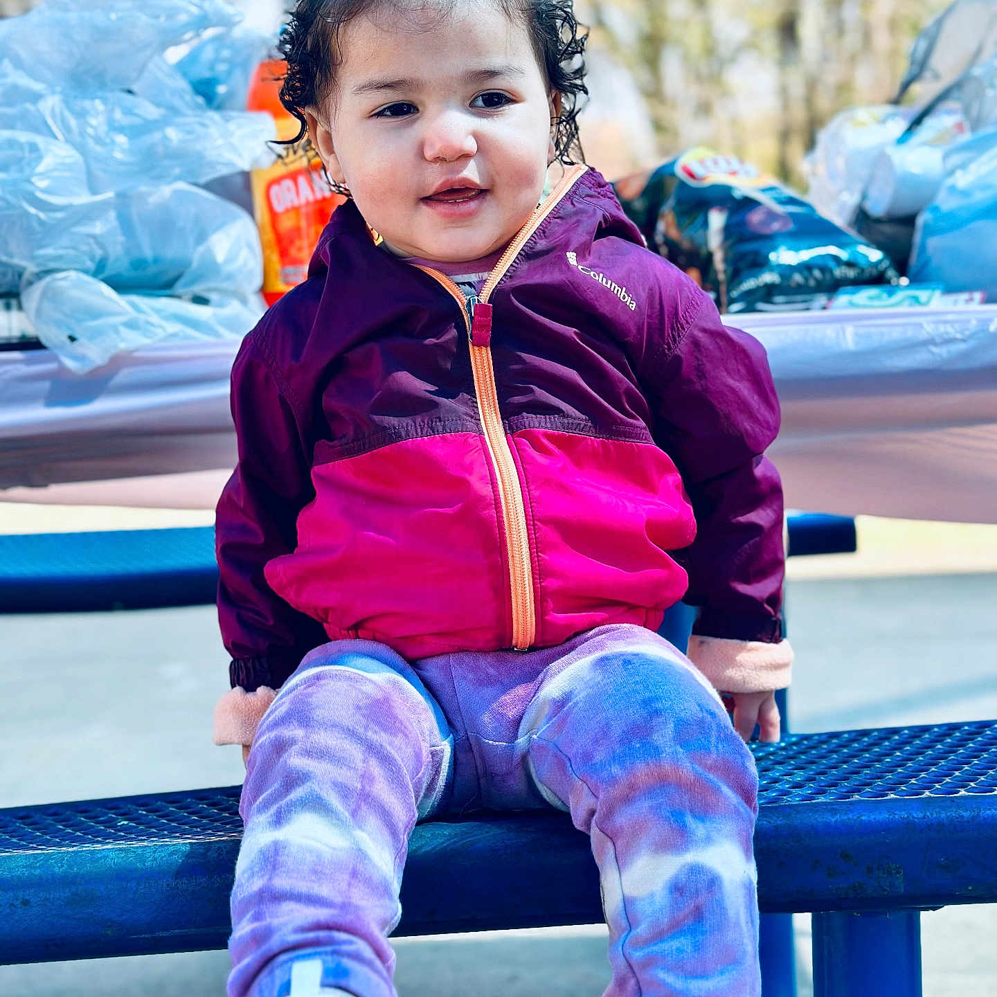 Londynn is registered to the contest to win money with this photo: child, clothing, coat, face, female, footwear, girl, happy, head, jacket, jeans, outdoorplayarea, outdoors, pants, person, photography, playarea, portrait, shoe, sitting
