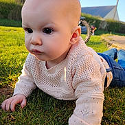 Maé participe au concours pour gagner de l'argent avec cette photo : baby, infant, child, sweater, knitwear, grass, lawn, outdoors, sunlight, portrait, closeup, hands, face, eyes, cheeks, jeans, bicycle, wheel, house, crawling