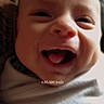Clayton joined the competition — help win amazing prizes! baby, infant, smiling, face, closeup, blanket, wrapped, happy, early_morning, indoors, child, cute, mouth_open, tongue_out, person, newborn, expression, soft_light, skin, portrait