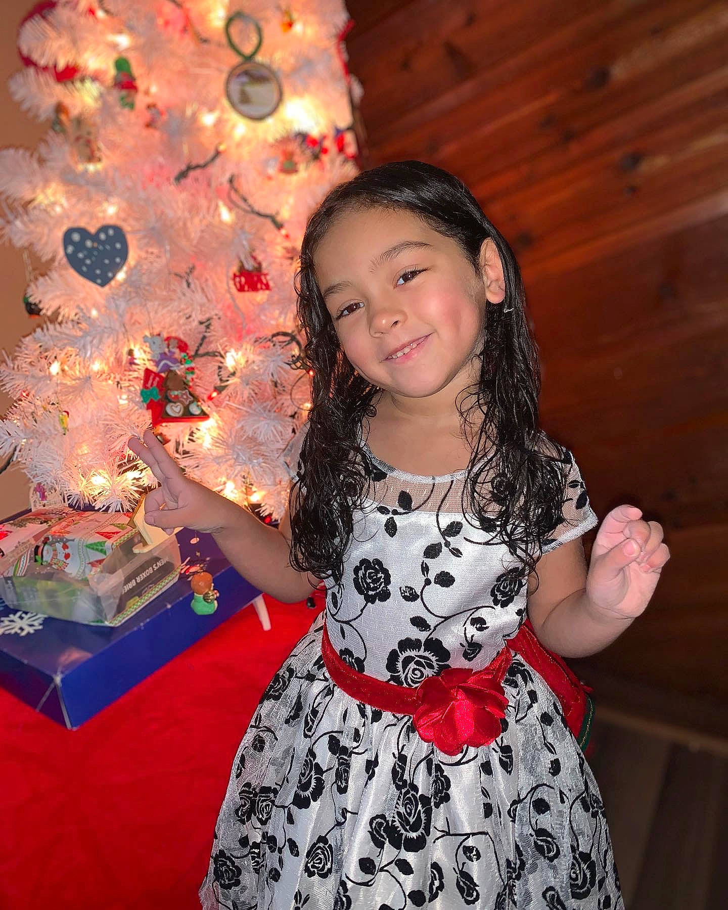 Unique is registered to the contest to win money with this photo: christmas_decoration, christmas_ornament, christmas_tree, day_dress, dress, event, facial_expression, fashion, fun, happy, holiday_ornament, joy, one_piece_garment, ornament, pattern, people, person, pink, sleeve, smile