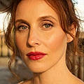 Laura L.