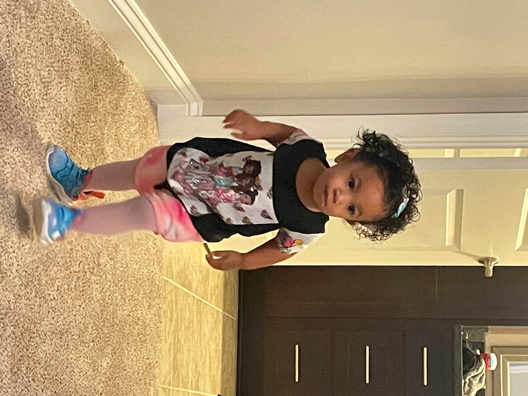 Eviana joined the competition — help win amazing prizes! ceiling, child, drawer, dress, flooring, fun, happy, house, human_body, human_leg, knee, pattern, person, play, room, sitting, t_shirt, textile, thigh, toddler