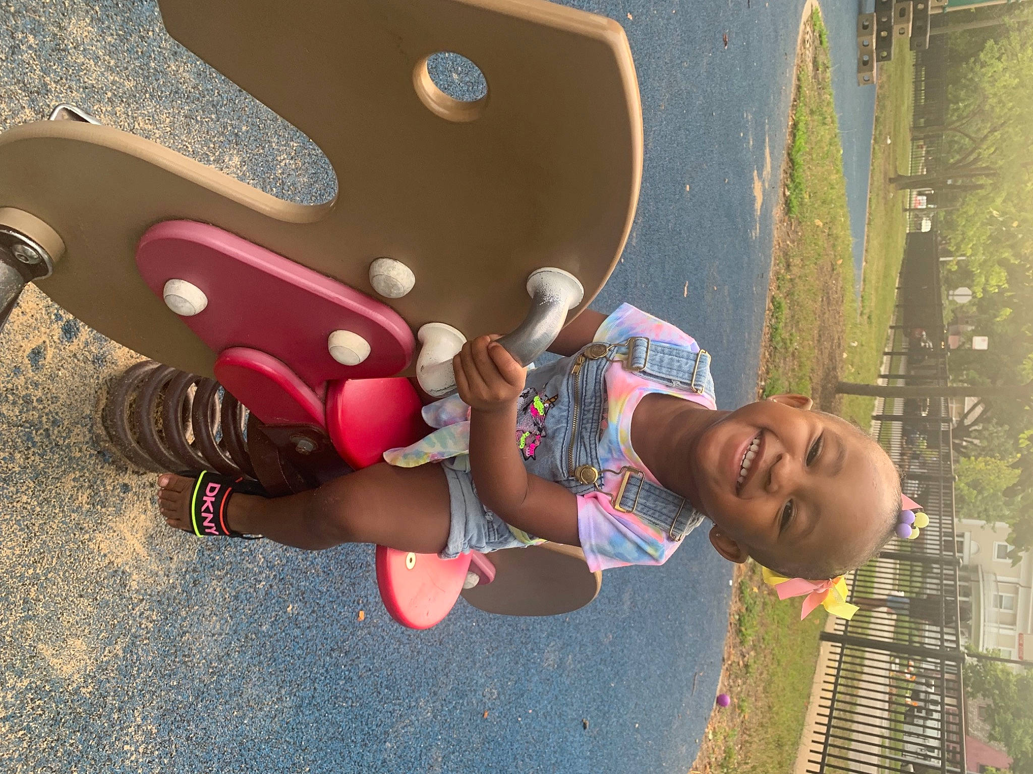 Camryn is registered to the contest to win money with this photo: carmine, child, city, cool, fun, happy, hat, joy, leisure, magenta, outdoor_play_equipment, person, personal_protective_equipment, play, playground, public_space, recreation, shorts, smile, t_shirt
