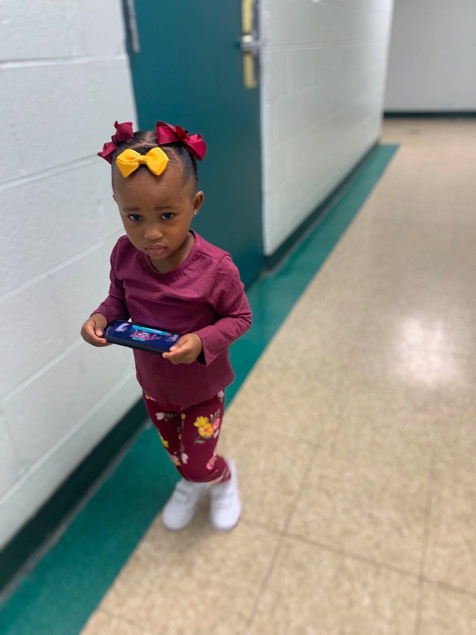 Camryn is registered to the contest to win money with this photo: baby, child, floor, flooring, fun, hardwood, human_body, human_leg, knee, leg, leisure, person, recreation, shorts, sleeve, sock, sportswear, t_shirt, thigh, toddler