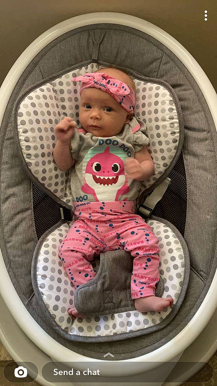 Kayla joined the competition — help win amazing prizes! baby, baby_carriage, baby_products, baby_safety, baby_sleeping, baby_toddler_clothing, bag, carmine, cheek, child, circle, comfort, fashion_accessory, headwear, pattern, person, personal_protective_equipment, pink, product, sitting