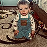 Lawson joined the competition — help win amazing prizes! bed, brown_eyes, carpet, child, clothing, curly_hair, door, face, home, indoor, kneeling, overalls, patterned_rug, person, plush_toy, rosy_cheeks, snack, toddler, toy, window_light