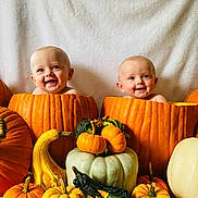 Madison And Melanie is registered to the contest to win money with this photo: baby, pumpkin, smile, fall, autumn, gourd, orange, white_background, cute, child, holiday, festive, harvest, nature, fun, portrait, two_children, seasonal, decoration, happy