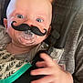 Madison And Melanie joined the competition — help win amazing prizes! baby, pacifier, mustache, face, hand, car_seat, clothing, wide_eyes, expression, infant, person, child, blanket, fabric, strap, cute, indoors, closeup, funny, accessory