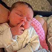 Annabelle joined the competition — help win amazing prizes! animal_print, baby, blanket, child, cozy, cushion, cute, finger, indoors, infant, knitted, newborn, nose, onesie, peaceful, pink, portrait, resting, sleeping, soft