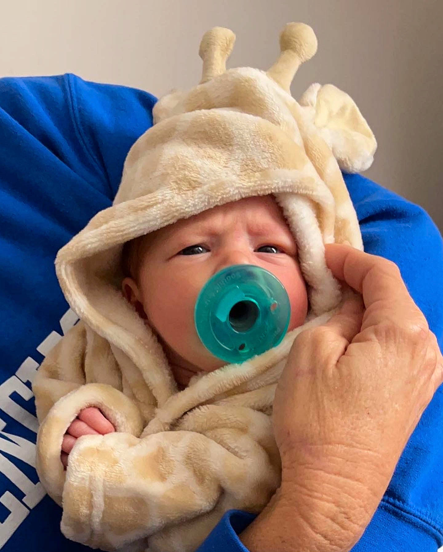 Annagrace is registered to the contest to win money with this photo: baby, baby_products, baby_sleeping, cap, cheek, child, close_up, comfort, eye, face, finger, gesture, headgear, headwear, knit_cap, linens, mouth, nose, person, skin