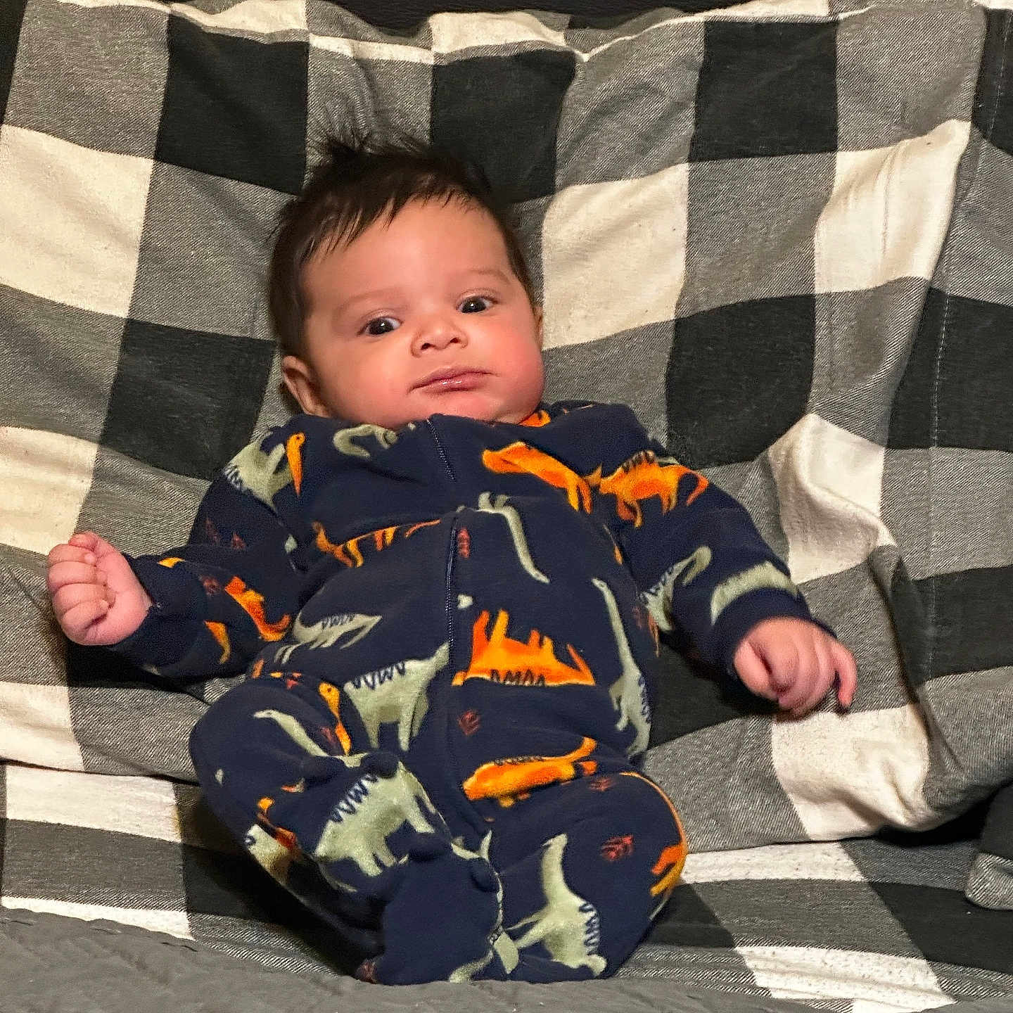 Carter is registered to the contest to win money with this photo: baby, bed, bedroom, blanket, clothing, couch, cushion, face, furniture, glove, head, homedecor, indoors, pajamas, pants, person, photography, portrait, quilt, room