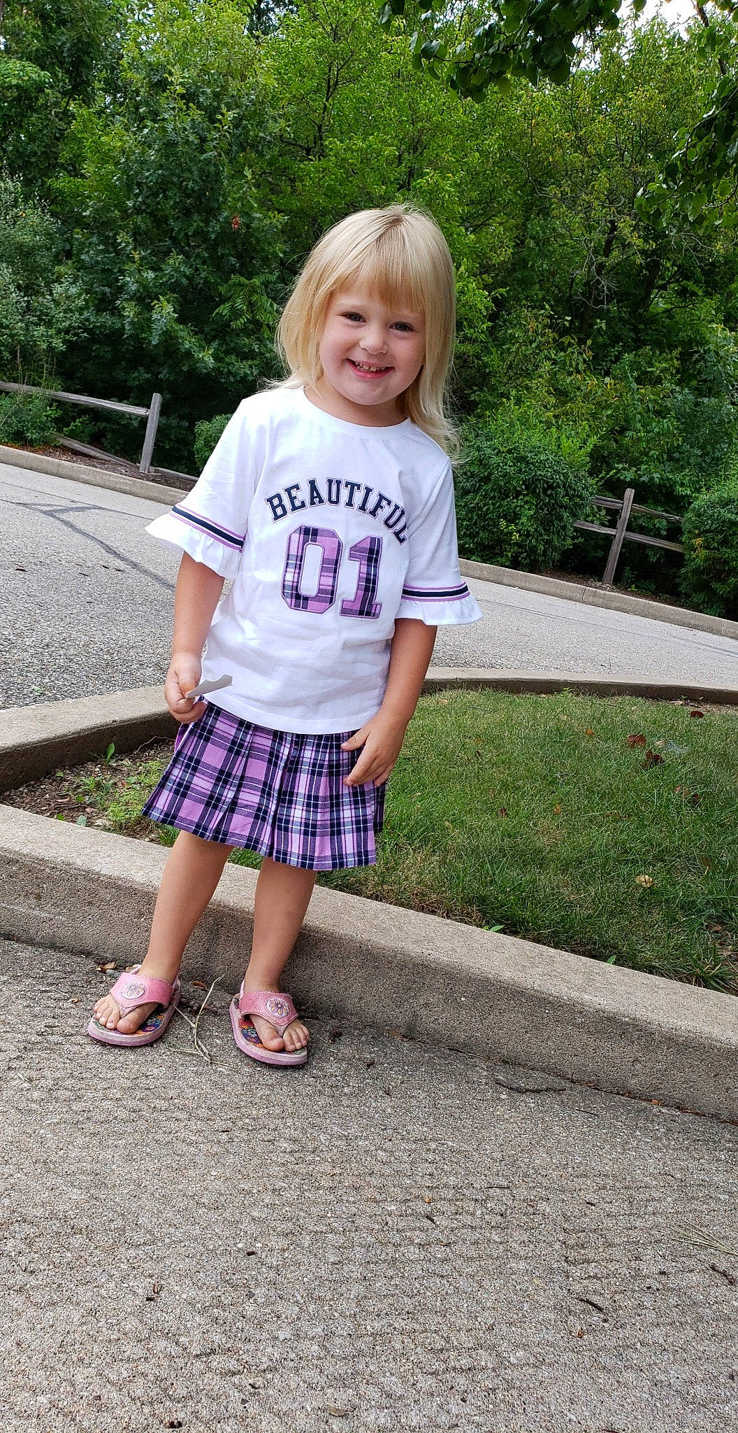 Izabelle is registered to the contest to win money with this photo: child, clothing, cool, design, dress, footwear, joy, pattern, person, photograph, pink, plaid, shorts, sleeve, snapshot, summer, t_shirt, tartan, textile, toddler