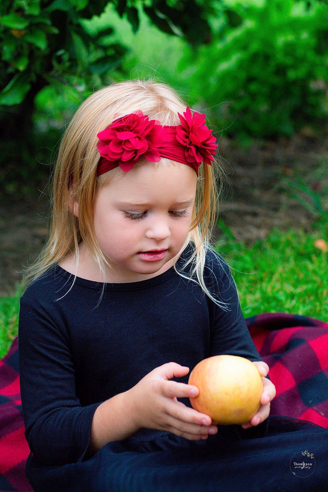 Izabelle is registered to the contest to win money with this photo: apple, baby, blond, child, child_model, fruit, grass, hair_accessory, headband, headgear, malus, person, photography, pink, plant, play, rose_family, toddler