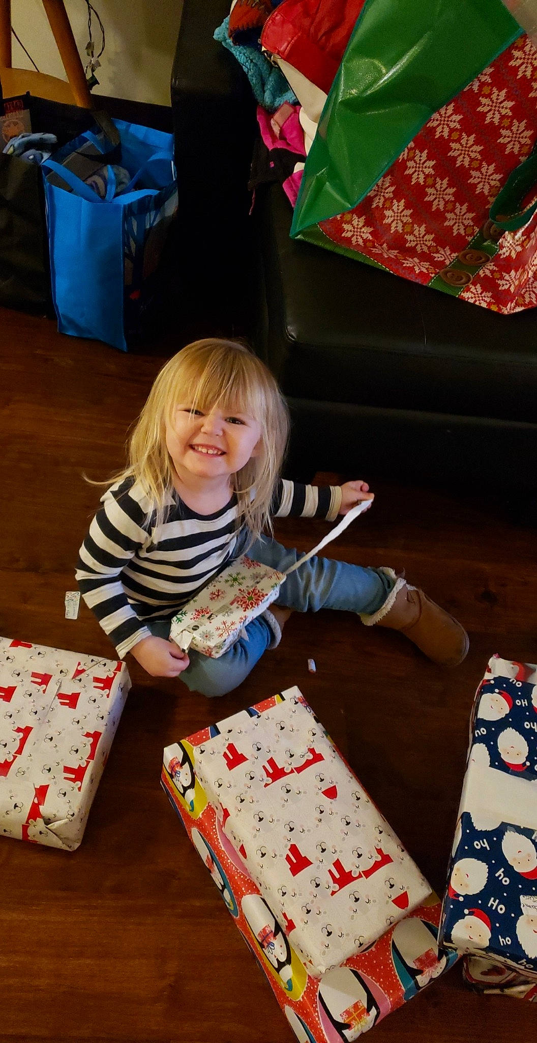 Samantha is registered to the contest to win money with this photo: child, christmas, christmas_eve, gift_wrapping, holiday, joy, opening_presents, person, play, present, textile, toddler