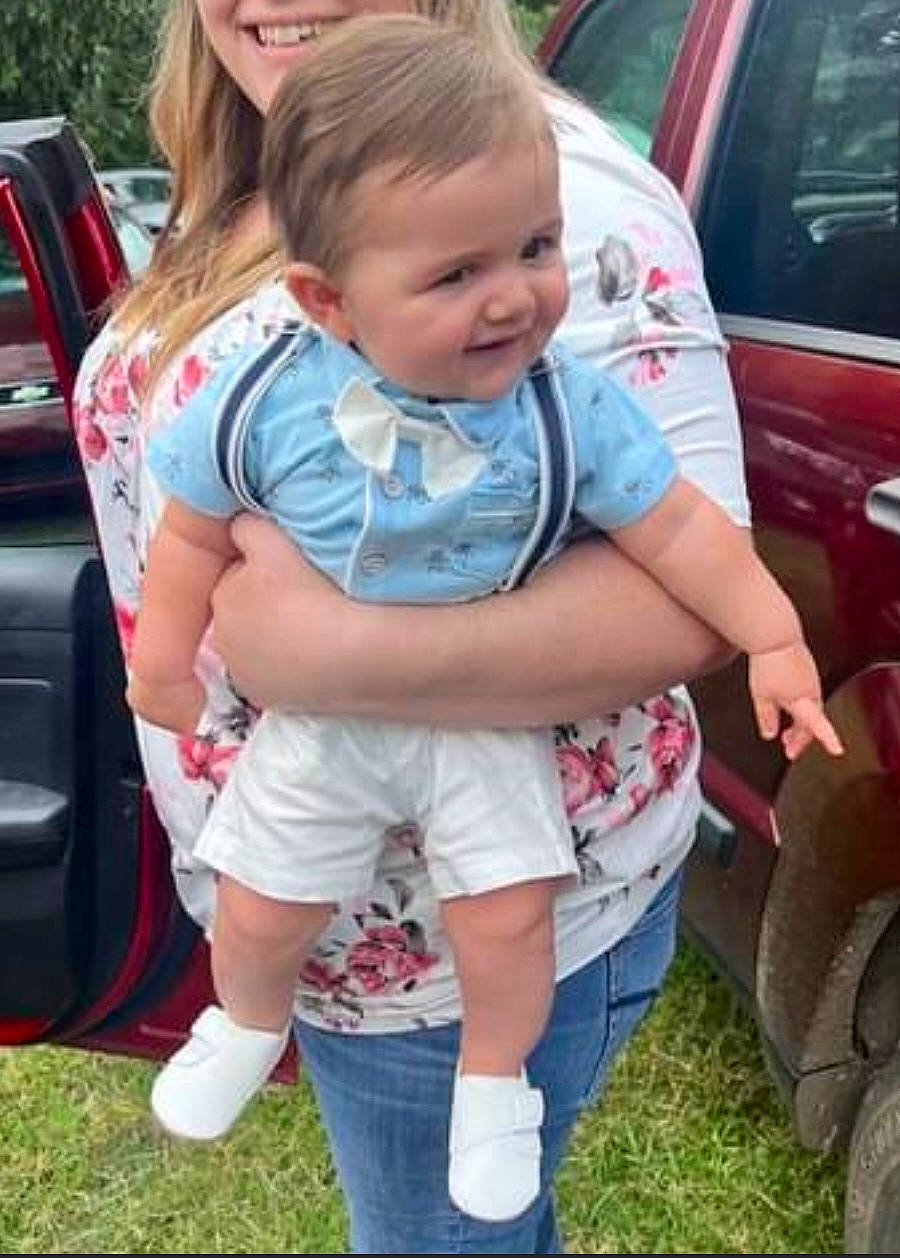 Channing joined the competition — help win amazing prizes! automotive_exterior, automotive_tire, car, cool, fun, grass, happy, jeans, land_vehicle, lawn, motor_vehicle, person, pink, plant, shoe, shorts, sneakers, tire, toddler, vehicle_door