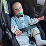 baby, child, car_seat, pacifier, bow_tie, white_shirt, beige_pants, white_socks, safety_belt, car_interior, seatbelt, infant, cute, portrait, strapped_in, car_travel, young_child, face, looking_at_camera, comfort