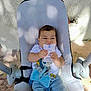 baby, infant, baby_seat, plush_toy, outdoor, sunlight, shadow, card, holding, cute, child, clothing, shorts, white_shirt, face, expression, toy, comfort, seat, playful
