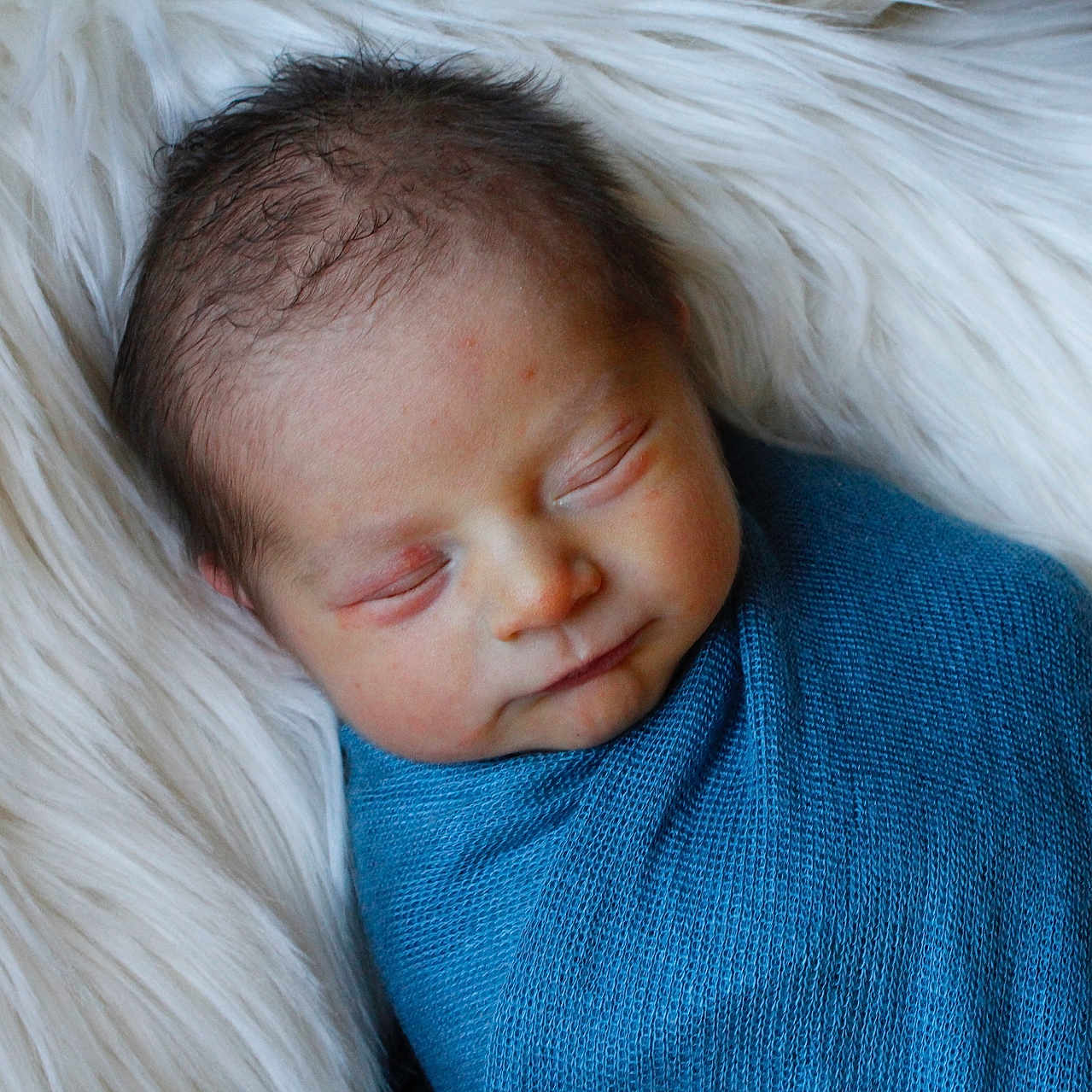 Liam is registered to the contest to win money with this photo: angel, baby, blanket, cushion, face, happy, head, homedecor, newborn, person, photography, portrait, sleeping, smile