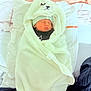 Thaylo participe au concours pour gagner de l'argent avec cette photo : newborn, baby, infant, blanket, towel, hood, hat, sleeping, bed, pillow, swaddle, hospital_bed, cozy, cute, portrait, top_view, white_blanket, pink_sheet, tag, person