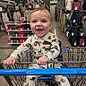 Huxley joined the competition — help win amazing prizes! baby, shopping_cart, clothing_store, onesie, smiling, child, retail, baby_clothes, store_aisle, folded_clothes, hanging_clothes, indoor, person, happy, infant, retail_display, floor, shopping, baby_hands, cute