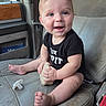 Huxley joined the competition — help win amazing prizes! baby, child, infant, smile, blue_eyes, onesie, car_seat, pacifier, worn_seat, cute, happy, sitting, handheld_object, barefoot, short_hair, inside_car, seatbelt, car_interior, portrait, person