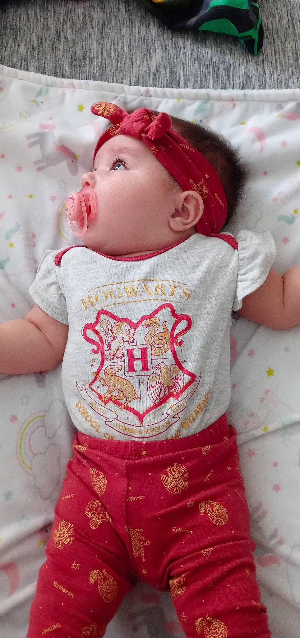 Scarlett is registered to the contest to win money with this photo: baby, baby_toddler_clothing, cap, cheek, child, dress, eye, happy, hat, lip, magenta, pattern, person, pink, product, red, skin, sleeve, t_shirt, textile