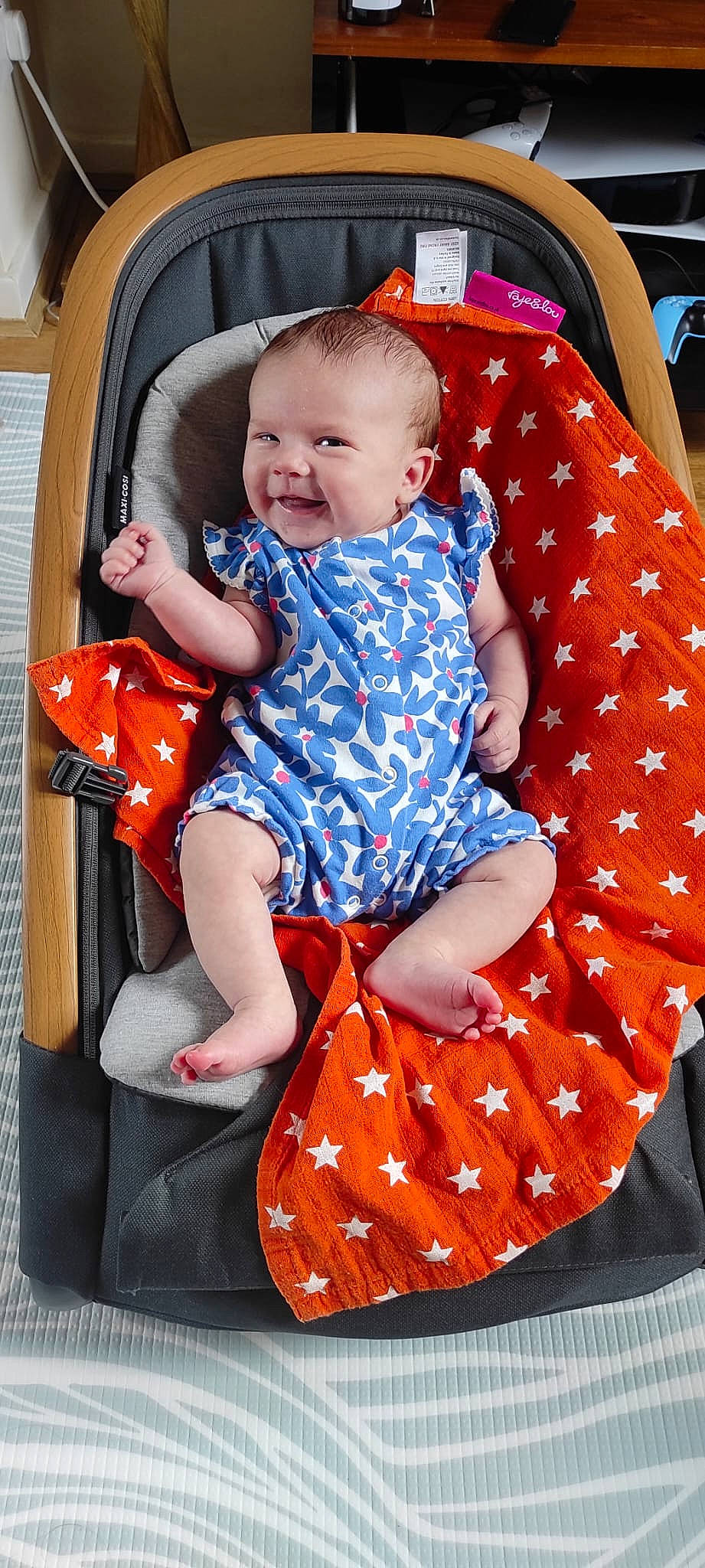 Amara is registered to the contest to win money with this photo: baby, baby_carriage, baby_products, baby_toddler_clothing, chair, child, electric_blue, event, facial_expression, fun, lap, pattern, people, person, photograph, product, red, sitting, smile, snapshot