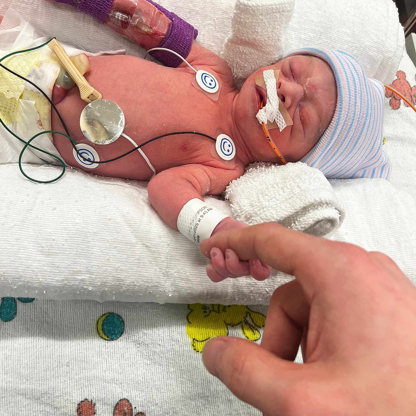 Waylon is registered to the contest to win money with this photo: architecture, arm, baby, bodypart, building, clinic, clothing, face, finger, furniture, glove, hand, hat, head, hospital, newborn, person, photography, portrait, wrist