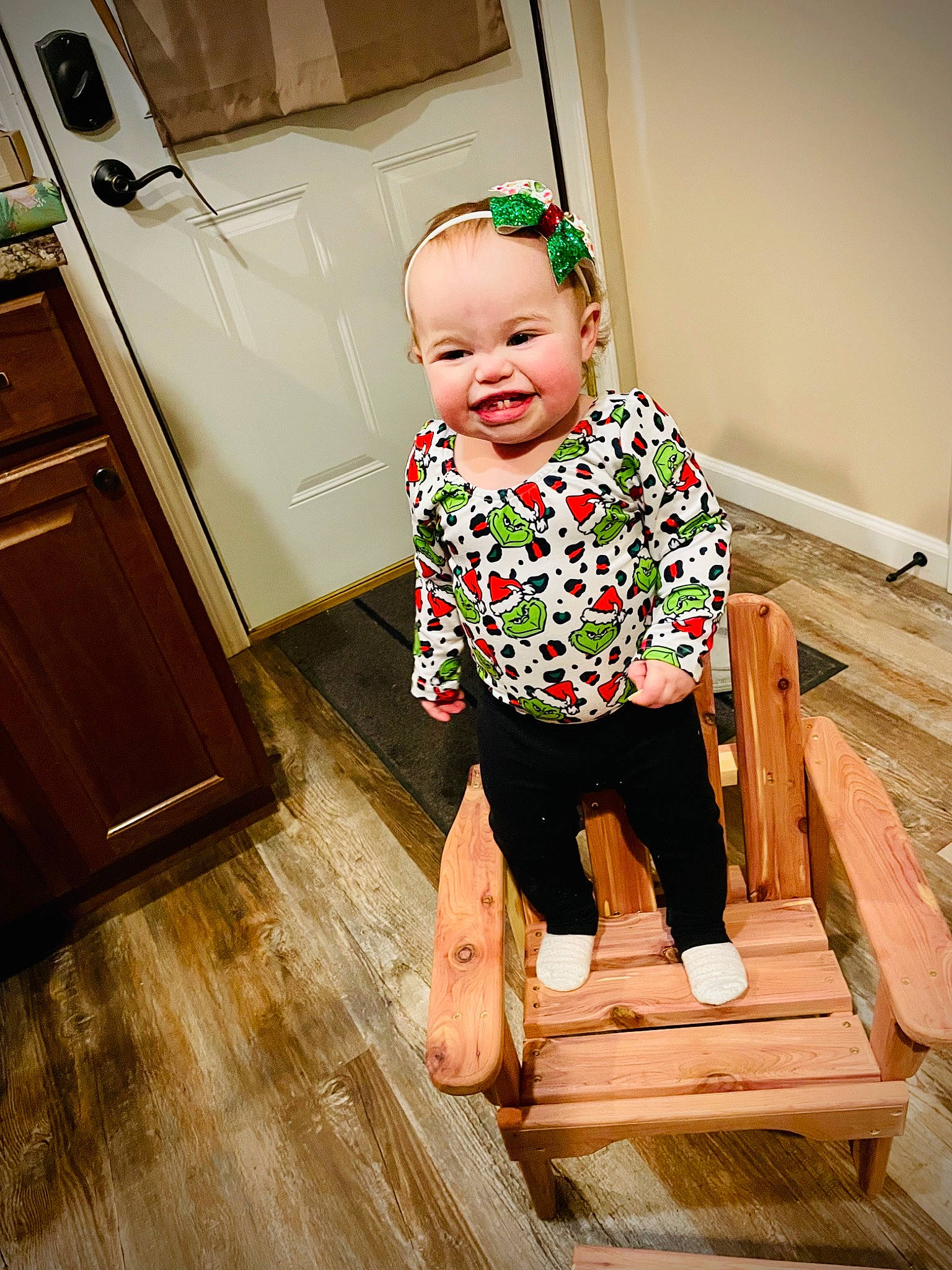 Morrelli is registered to the contest to win money with this photo: baby, baby_toddler_clothing, cabinetry, child, drawer, floor, flooring, gas_stove, happy, hardwood, home_appliance, joy, kitchen_appliance, person, refrigerator, sleeve, smile, standing, t_shirt, toddler