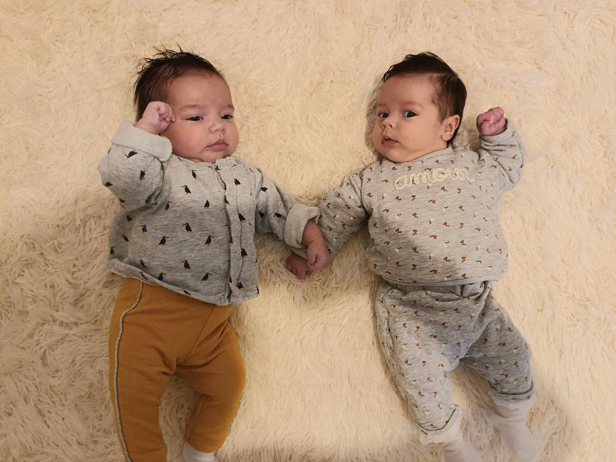 Paola participe au concours pour gagner de l'argent avec cette photo : art, baby, baby_toddler_clothing, barefoot, child, comfort, fun, fur, gesture, happy, linens, love, nose, pajamas, pattern, people_in_nature, person, play, sitting, sleeve