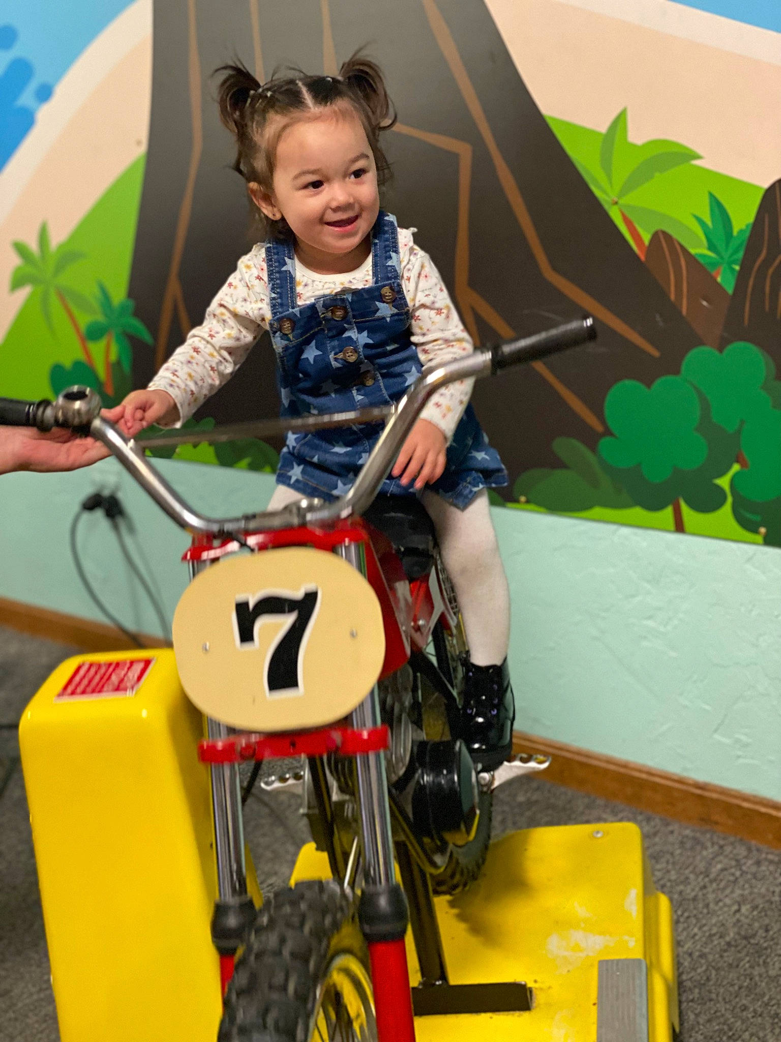 Cienna is registered to the contest to win money with this photo: auto_part, automotive_design, automotive_tire, automotive_wheel_system, child, electric_blue, fun, happy, joy, motor_vehicle, person, riding_toy, rim, rolling, smile, tire, toddler, toy, toy_vehicle, tread