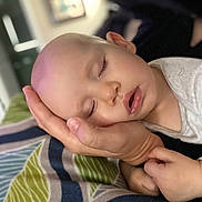 Juliette Rae joined the competition — help win amazing prizes! baby, sleeping, hand, face, infant, peaceful, indoor, closeup, person, resting, cushion, pattern, soft_light, portrait, newborn, child, parent, comfort, cozy, toddler