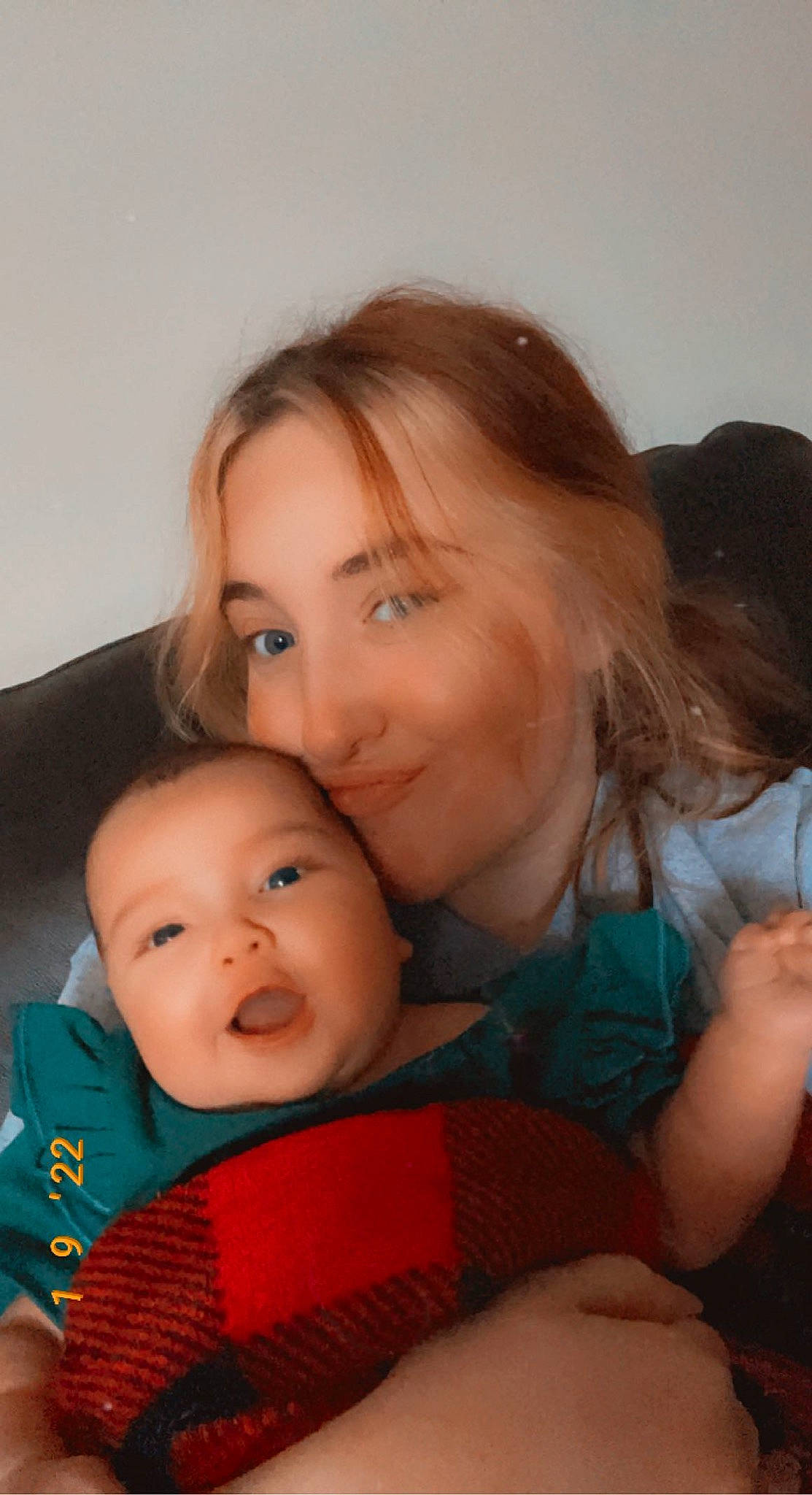 Mara joined the competition — help win amazing prizes! baby, blond, cheek, child, comfort, couch, finger, fun, gesture, happy, interaction, iris, joy, lap, mouth, nose, person, room, sitting, skin