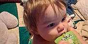 Jordan is registered to the contest to win money with this photo: toddler, child, baby, face, hair, blanket, pillow, bed, indoors, drink, hand, expression, cute, curious, clothing, skin, person, soft, texture, comfort