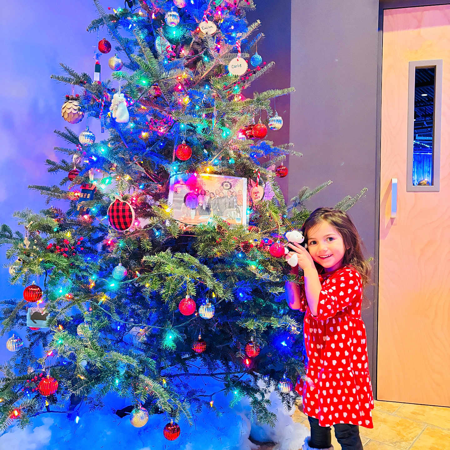Mia joined the competition — help win amazing prizes! child, christmas, christmasdecorations, christmastree, clothing, dress, face, female, festival, fir, footwear, girl, head, pattern, person, photography, plant, portrait, shoe, tree