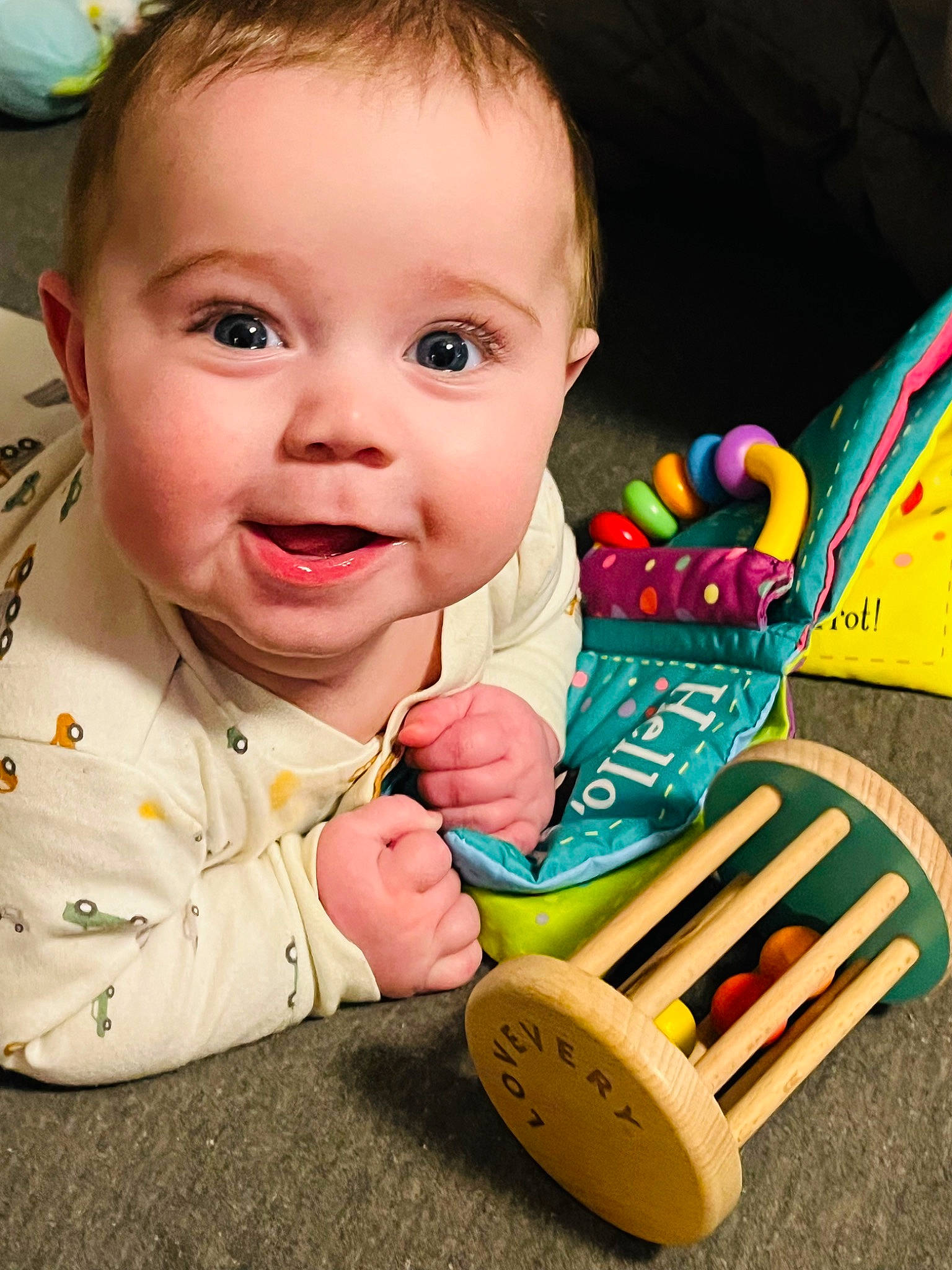 Jasper is registered to the contest to win money with this photo: baby, baby_playing_with_toys, baby_products, baby_toddler_clothing, cheek, child, eye, finger, fun, green, happy, iris, nose, organ, people, person, product, smile, toddler, toy