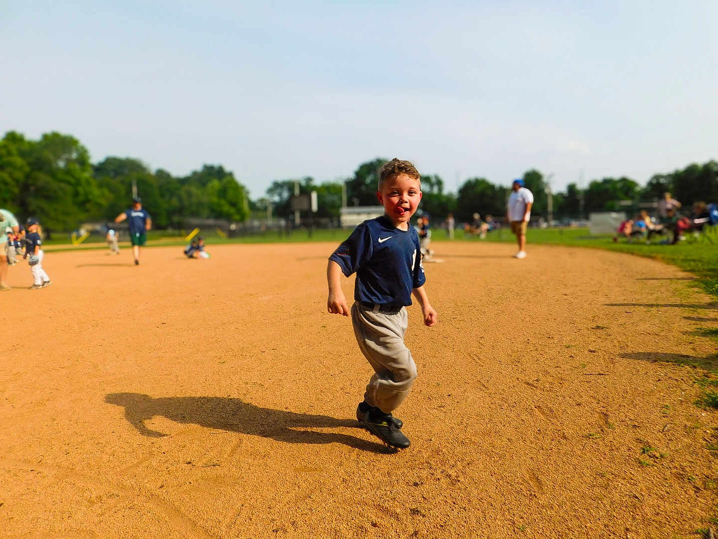Braxton joined the competition — help win amazing prizes! child, boy, baseball, sports, field, uniform, outdoor, sunny, grass, dirt, running, playful, tongue_out, team, game, people, spectators, summer, fun, youth