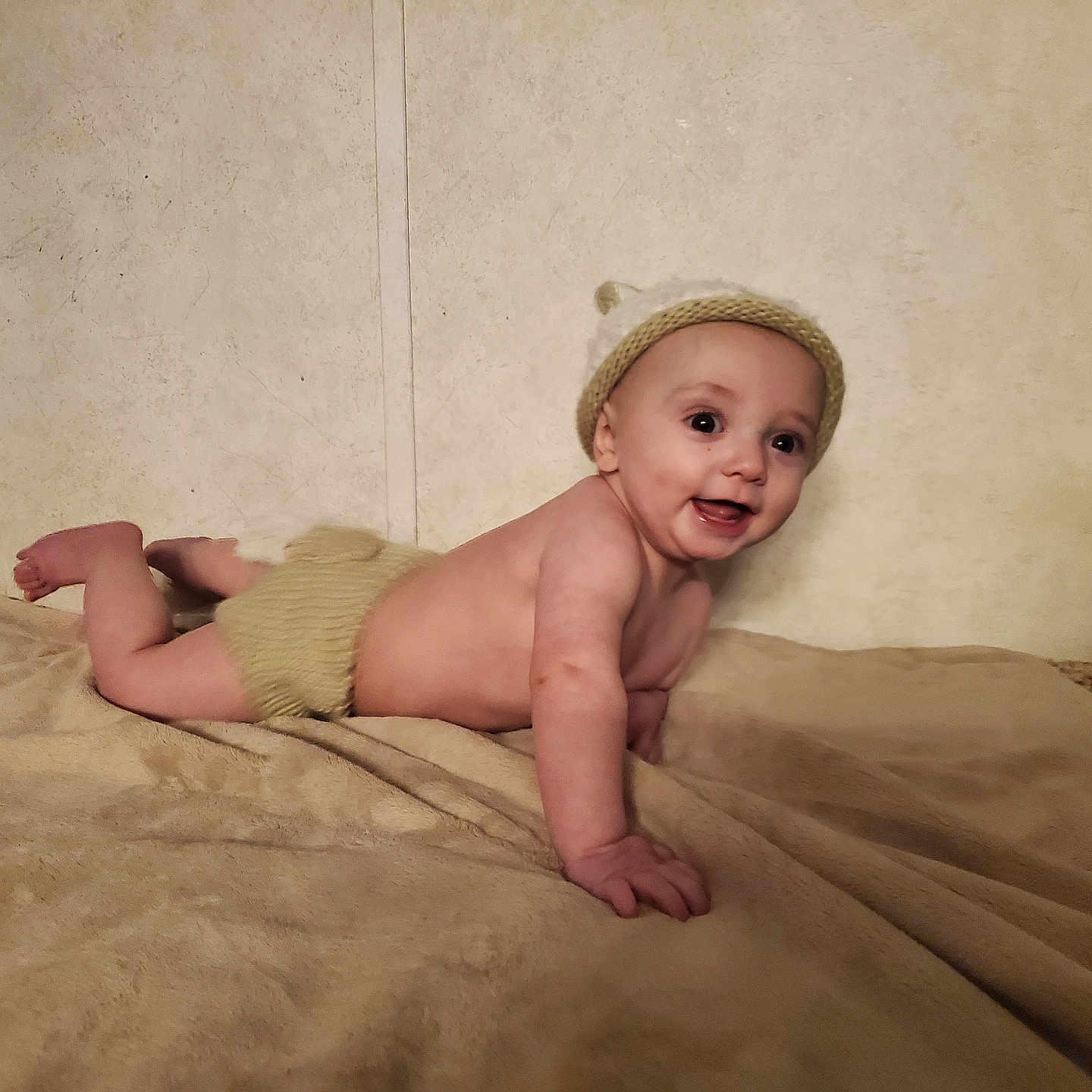 Benjamin Jaxson joined the competition — help win amazing prizes! baby, blanket, bodypart, bonnet, cap, clothing, crawling, face, finger, hand, happy, hat, head, newborn, person, photography, portrait, sitting, smile, wood