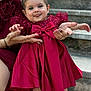 baby, child, dress, bow, red_dress, smile, tongue_out, hands, adult, manicure, nails, person, stairs, outdoor, stone_steps, cute, portrait, holding, fashion, celebration