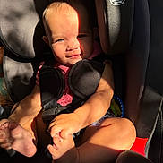 Oaklynn joined the competition — help win amazing prizes! baby, child, car_seat, sunlight, shadow, face, feet, sitting, graco, seatbelt, infant, pink_clothing, curious, expression, indoor, safety, child_safety, person, closeup, portrait