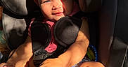 Oaklynn joined the competition — help win amazing prizes! baby, child, car_seat, sunlight, shadow, face, feet, sitting, graco, seatbelt, infant, pink_clothing, curious, expression, indoor, safety, child_safety, person, closeup, portrait