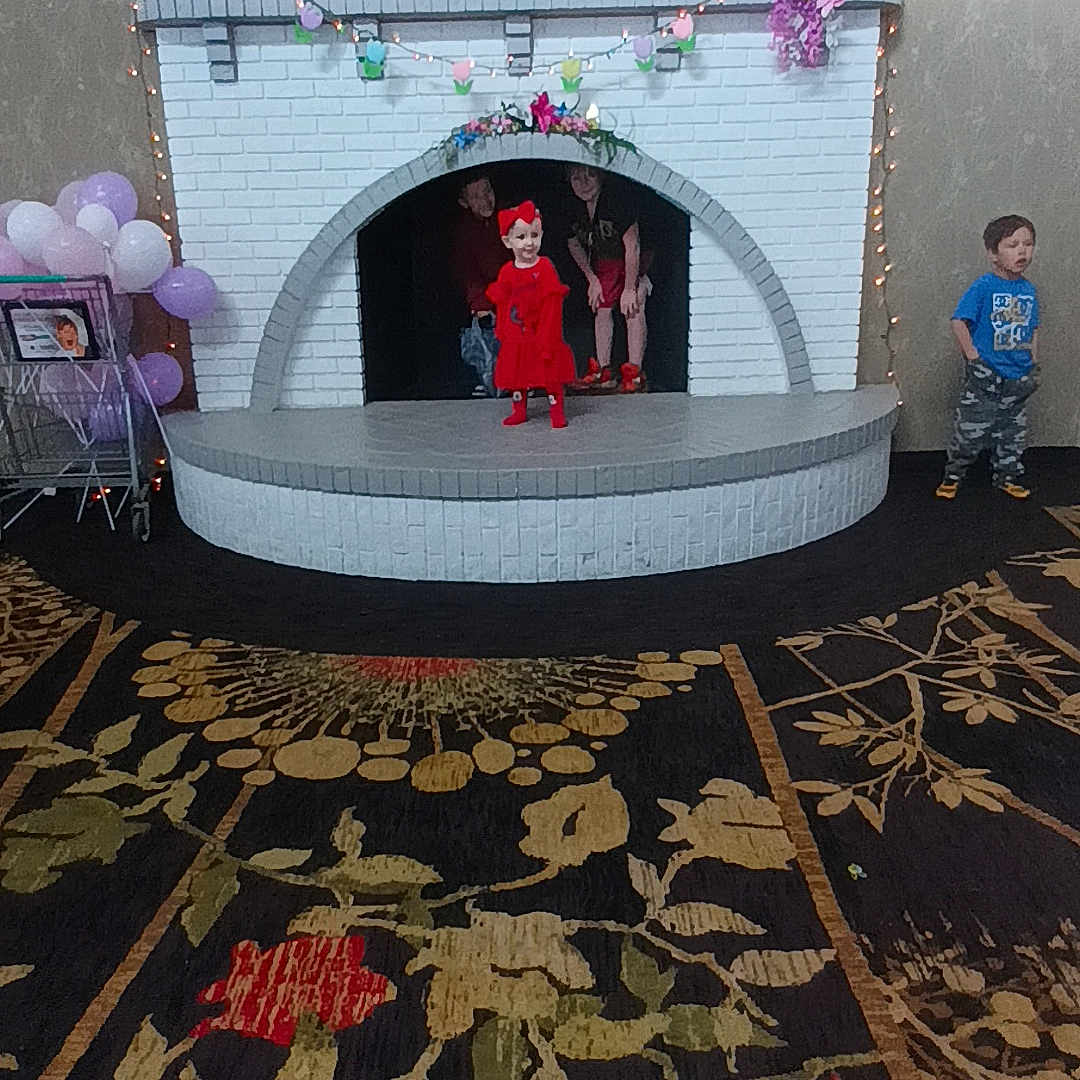 Kaylee joined the competition — help win amazing prizes! boy, child, clothing, dress, face, fashion, fireplace, footwear, formalwear, gown, head, hearth, homedecor, indoors, interiordesign, machine, male, person, shoe, wheel
